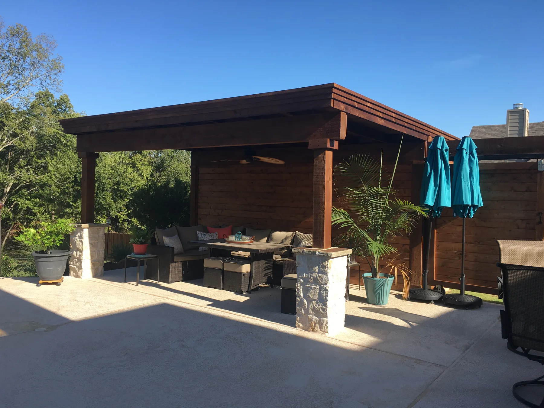 Wood patio cover with a shaded seating area